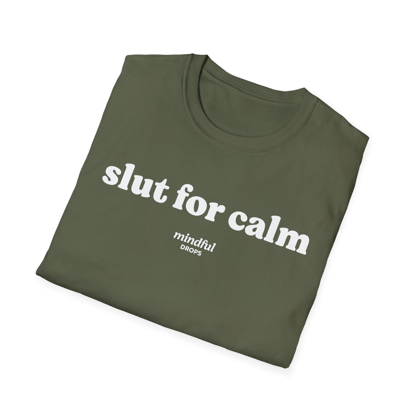 Folded green t-shirt with 'slut for calm' text on a white background