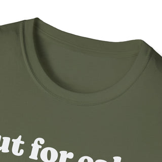 Close up of green shirt with white text on a white background